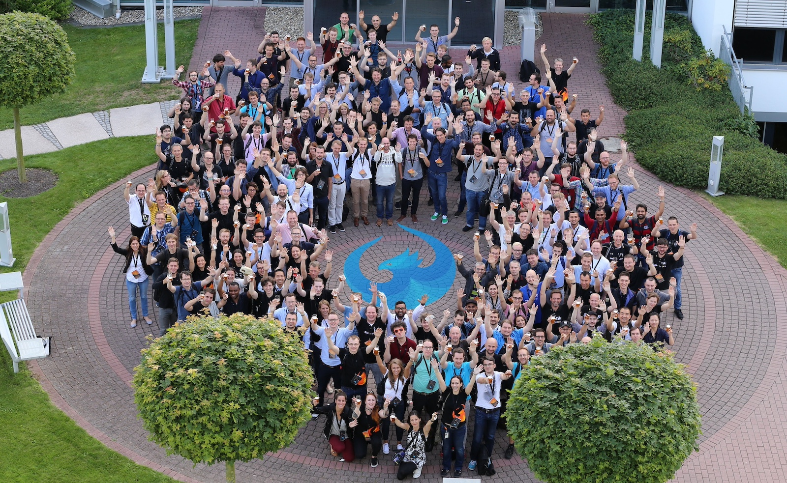 Picture of the UI5con participants from the top forming a circle around the OpenUI5 logo on the ground